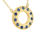 14 Karat Yellow Gold Open Halo Necklace With Blue Sapphires And Diamonds