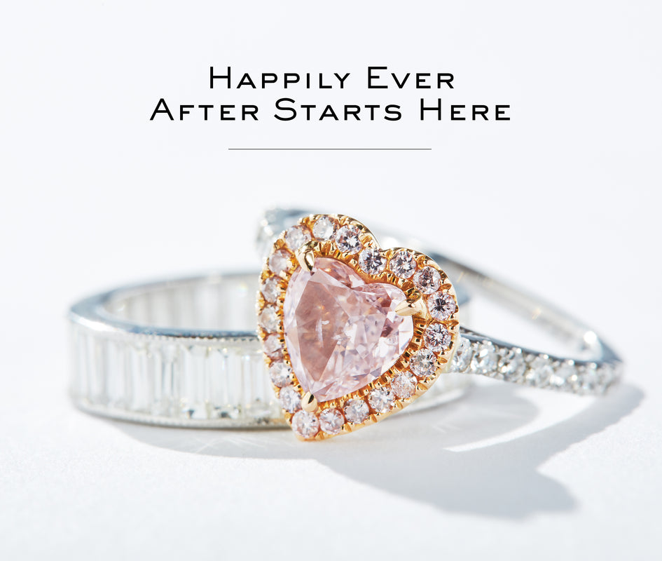 Two linked rings, engraved with happily ever after begins here