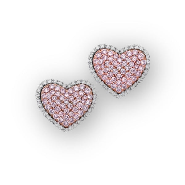 Heart-shaped earrings adorned with pink diamonds represent affection and style, transcending mere fashion.