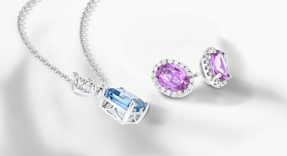 Vibrant purple and blue stones elegantly displayed on a white background, representing the Best Jewelry Store's quality