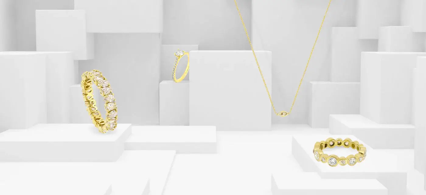 Elegant gold and diamond jewelry set against a simple white backdrop