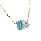 14 Karat Yellow Gold Toi Et Moi Necklace With A Emerald Cut Blue Topaz And Diamonds