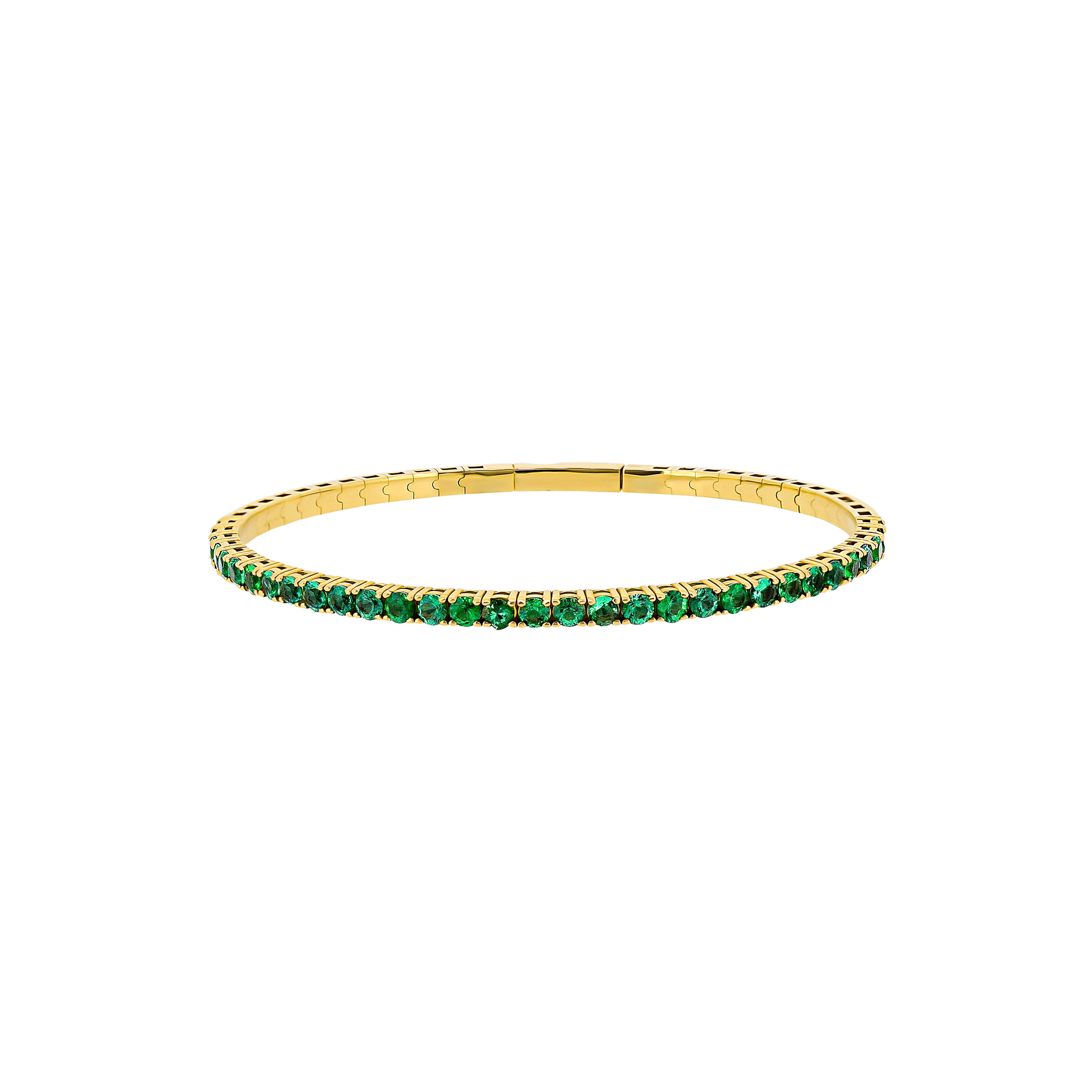 14 Karat Yellow Gold Flexible Bangle With Emeralds