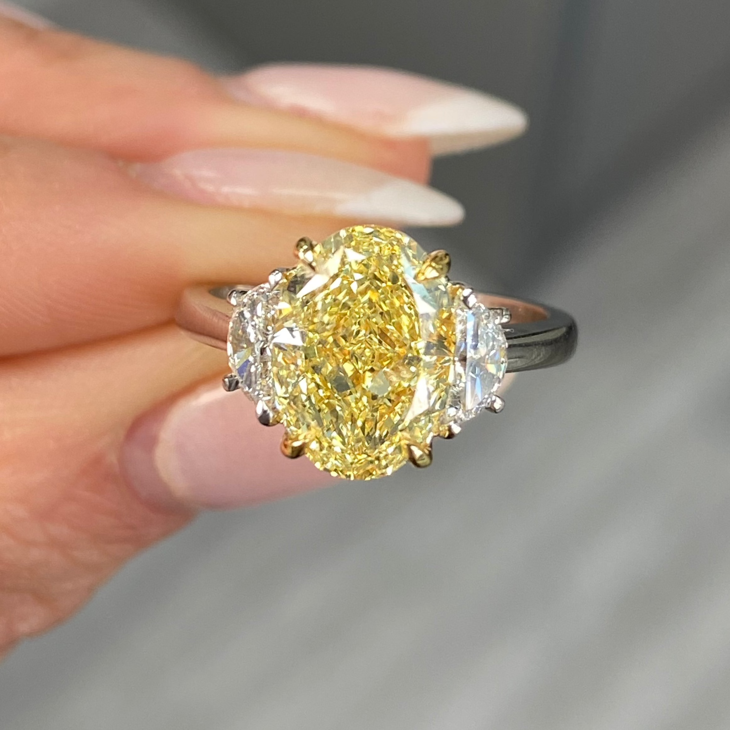 Stunning yellow oval cut diamond engagement ring featuring SI1 clarity.