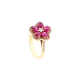 18 Karat Rose Gold Flower RIng with Oval Shaped Rubies and Diamonds