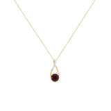 14 Karat Rose Gold Art Deco Necklace With A Garnet And Diamonds