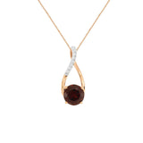 14 Karat Rose Gold Art Deco Necklace With A Garnet And Diamonds