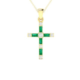 14 karat yellow gold cross necklace with emerald and round diamonds