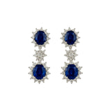 18 Karat White Gold Halo Drop Earrings With Blue Sapphires And Diamonds