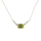 14 Karat White Gold Halo Necklace With A Peridot & Diamonds