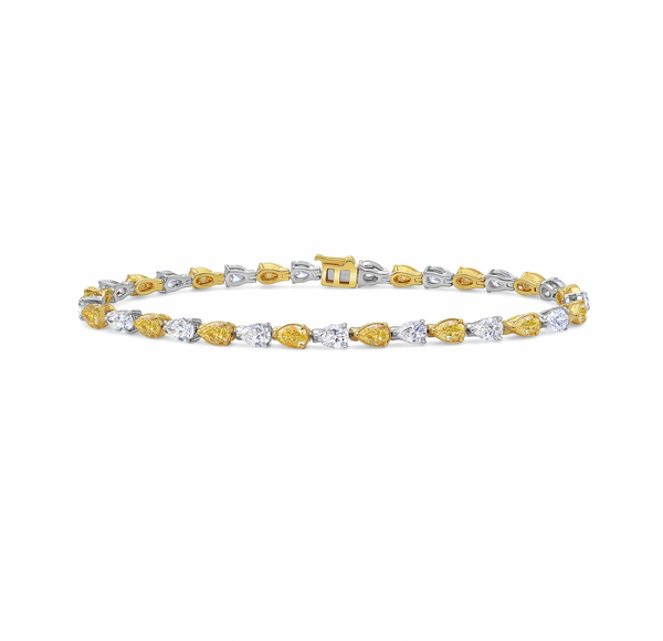 Luxurious bracelet pear-shaped fancy yellow and white diamonds in an elegant design.
