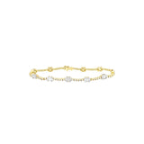 18 Karat Yellow Gold Station Bracelet with Baguette and Round Diamonds