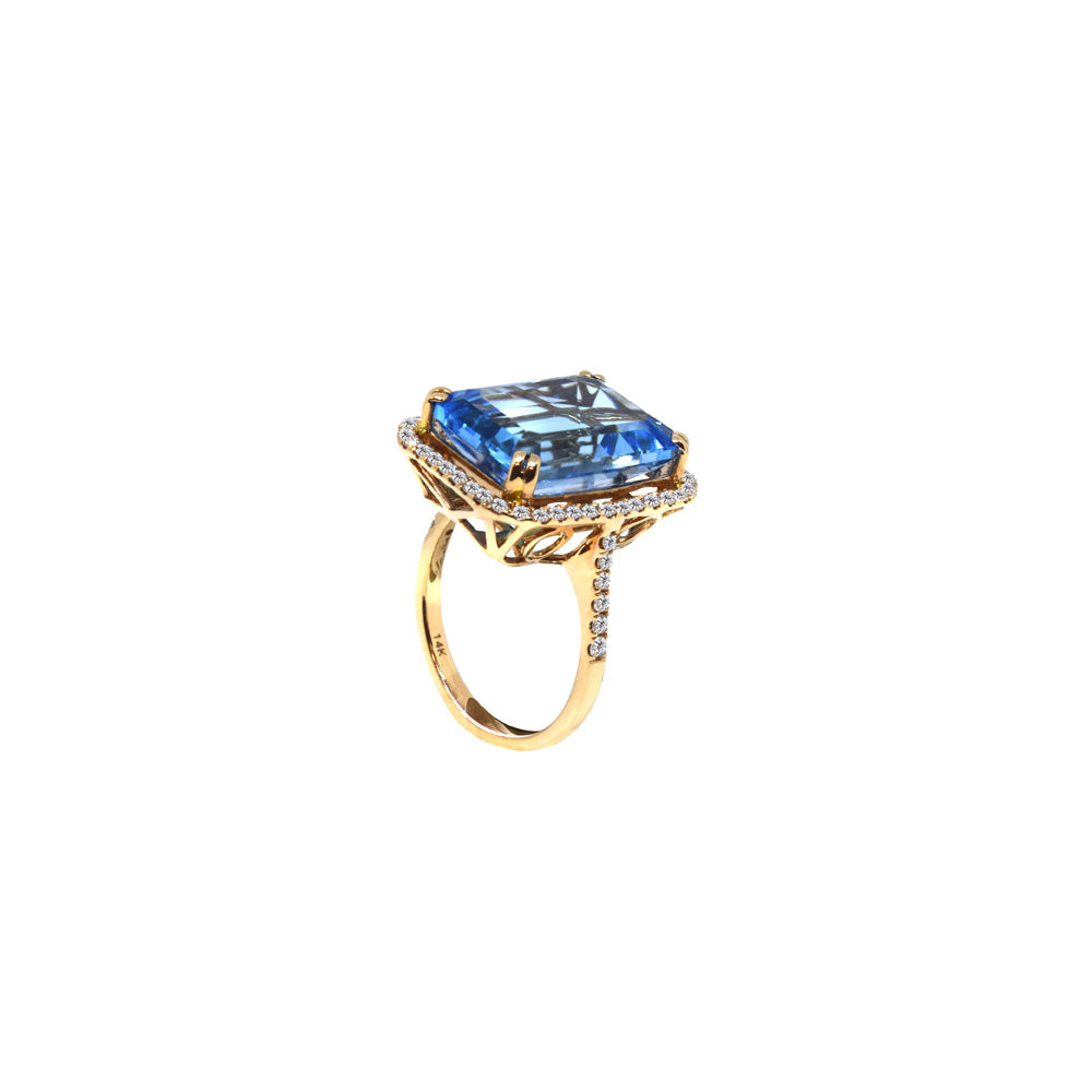 14 Karat Rose Gold Ring with Emerald Cut Blue Topaz