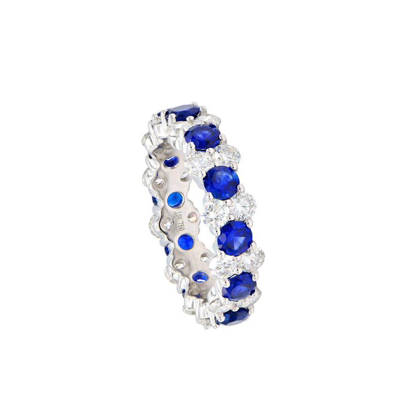 18 KARAT WHITE GOLD ETERNITY BAND WITH DIAMONDS AND BLUE SAPPHIRES